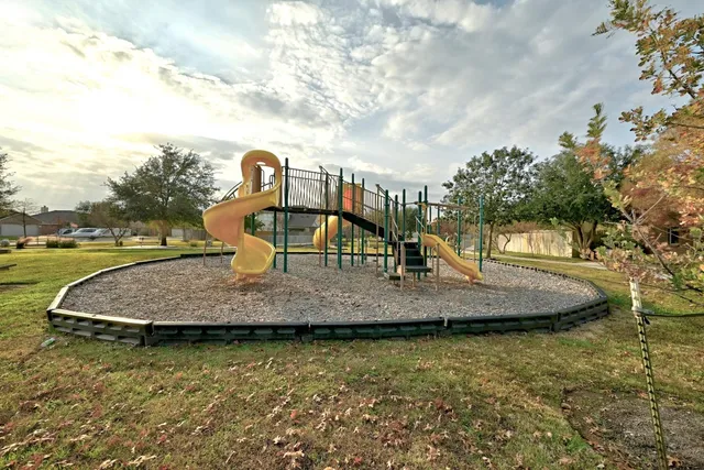 a view of a yard with large trees