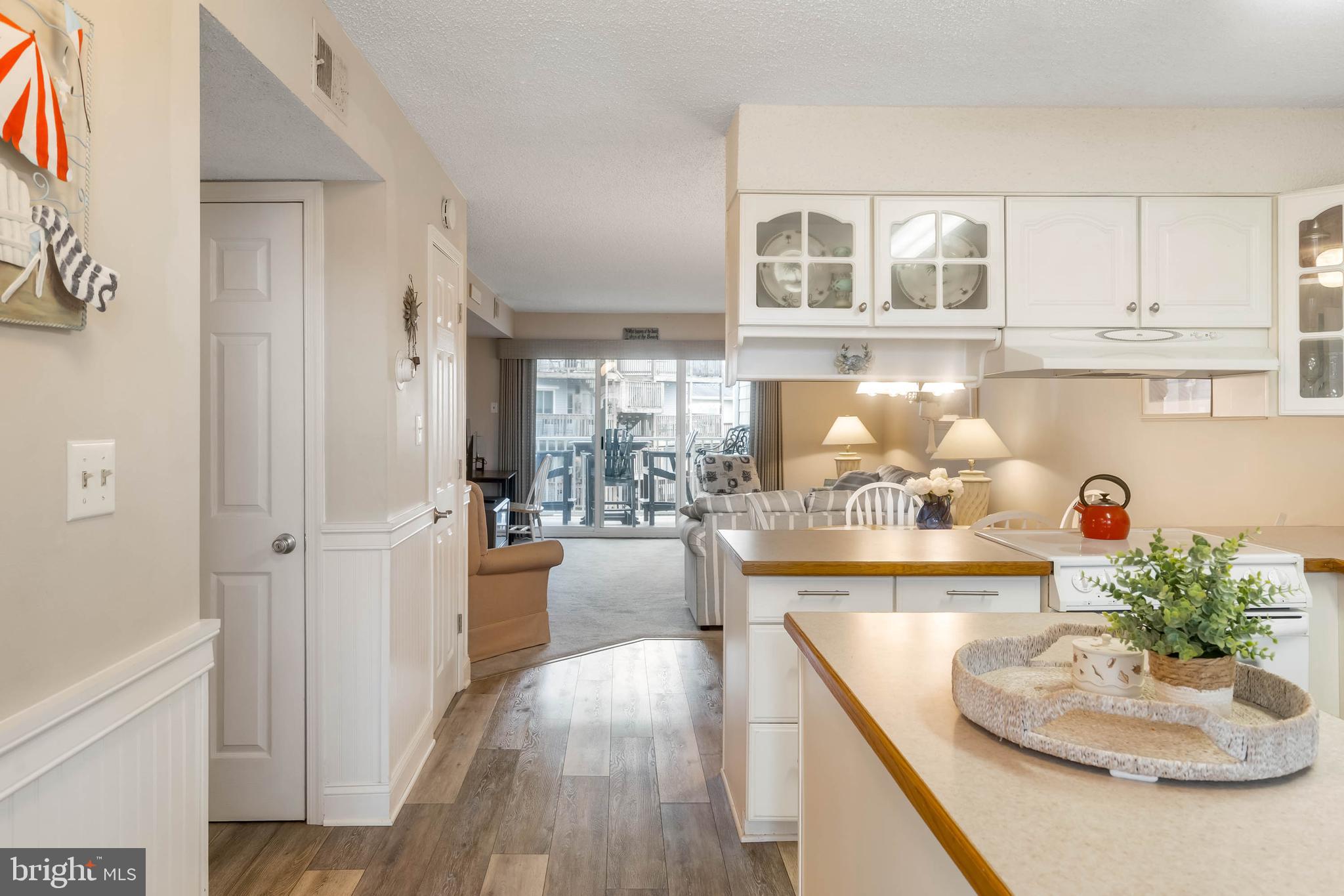 9203 Rusty Anchor Road, Unit A3 Ocean City, MD 21842 - Photo 3 of 40 a kitchen with cabinets and window