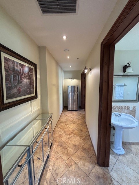 44 Hackamore Lane, Unit 46 Bell Canyon, CA 91307 - Photo 14 of 26 a view of a hallway with bathroom and a toilet