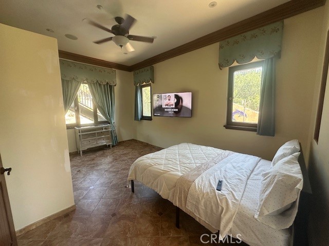 44 Hackamore Lane, Unit 46 Bell Canyon, CA 91307 - Photo 20 of 26 a bed sitting in a bedroom next to a window