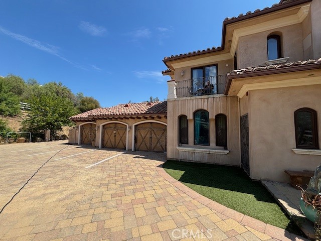 44 Hackamore Lane, Unit 46 Bell Canyon, CA 91307 - Photo 2 of 26 a front view of a house with a yard