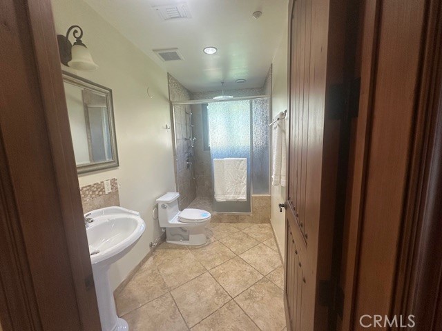 44 Hackamore Lane, Unit 46 Bell Canyon, CA 91307 - Photo 21 of 26 a bathroom with a granite countertop sink toilet and shower