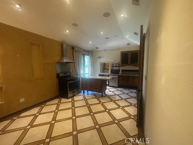 44 Hackamore Lane, Unit 46 Bell Canyon, CA 91307 - Photo 8 of 26 a kitchen with stainless steel appliances a refrigerator and a stove top oven