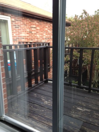 38 Westgate Road, Unit 5 Boston, MA 02467 - Photo 5 of 10 a view of a glass door with a yard