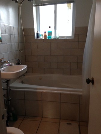 38 Westgate Road, Unit 5 Boston, MA 02467 - Photo 8 of 10 a bathroom with a sink a toilet and shower