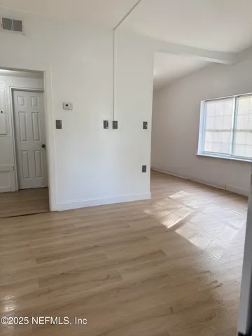 a view of a room with an empty space