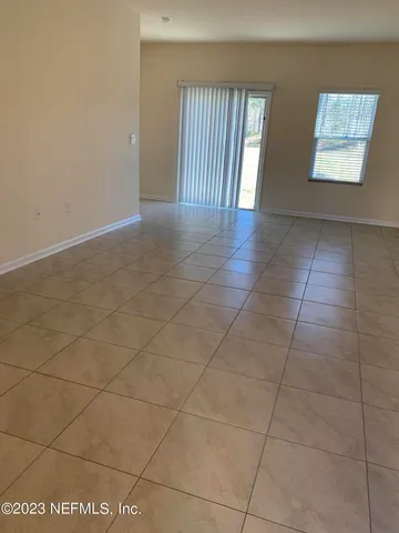 a view of an empty room and window