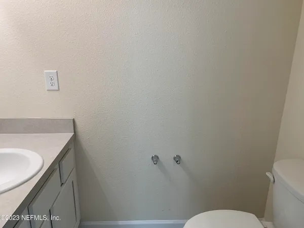 a bathroom with a sink and toilet