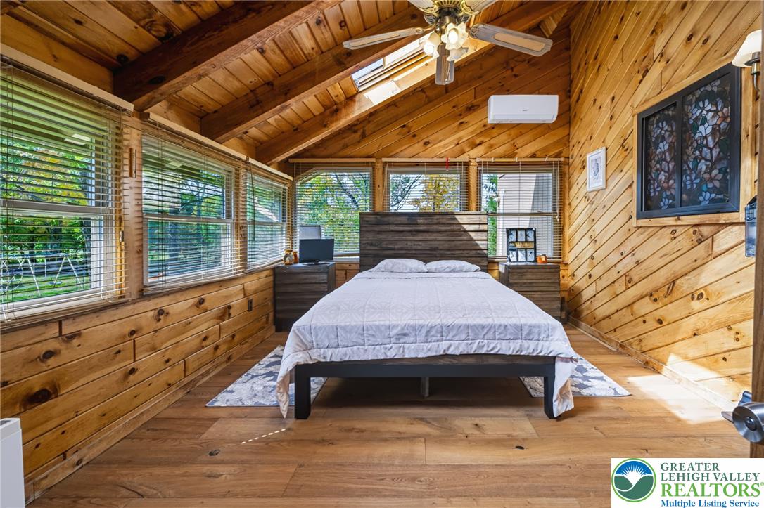 1605 Ridgeview Drive Lake Ariel, PA 18436 - Photo 17 of 40 Rich wood planking and exposed structural beams create a warm, rustic cabin aesthetic.