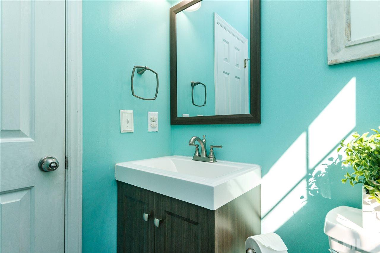 11205 North Radner Way Raleigh, NC 27613 - Photo 11 of 22 a bathroom with a sink and a mirror