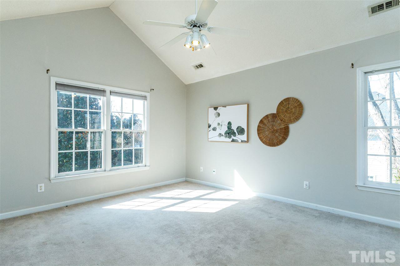 11205 North Radner Way Raleigh, NC 27613 - Photo 12 of 22 an empty room with windows and fan