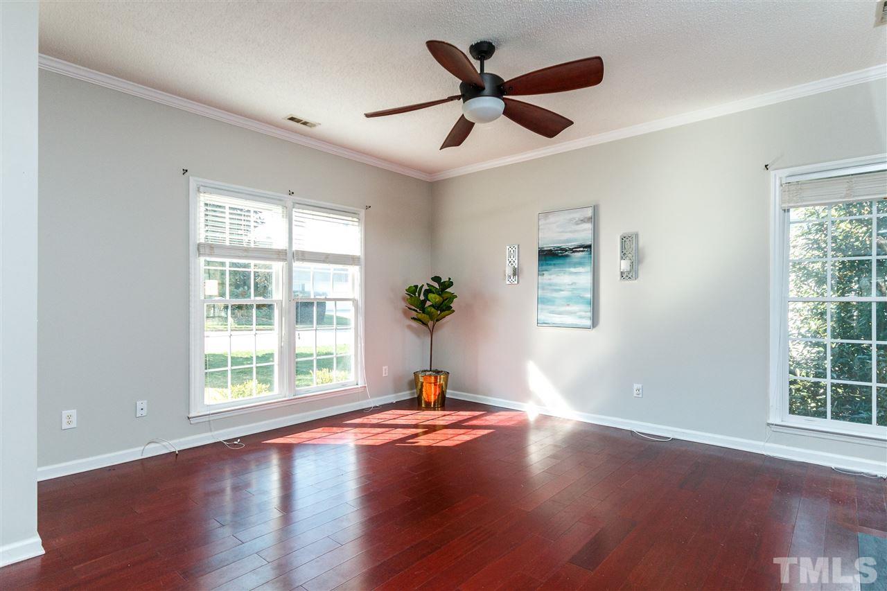 11205 North Radner Way Raleigh, NC 27613 - Photo 5 of 22 a living room with wooden floor and a window