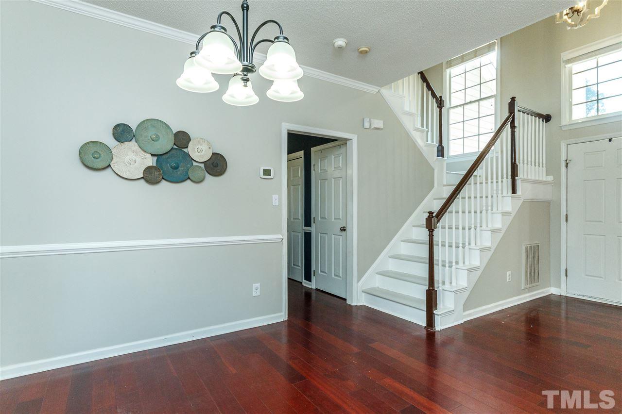 11205 North Radner Way Raleigh, NC 27613 - Photo 7 of 22 a view of entryway and hall with wooden floor