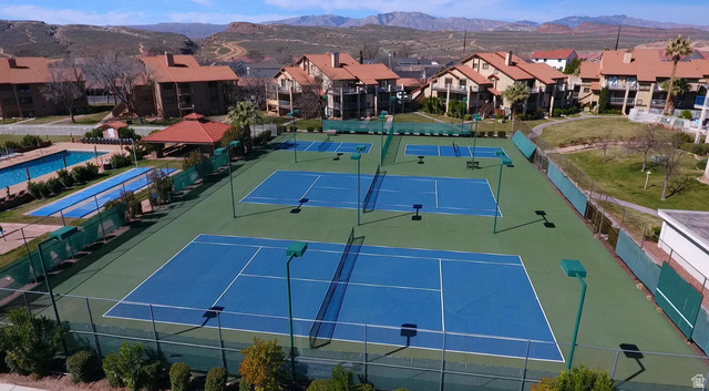 860 South Village Road, Unit H1 St. George, UT 84770 - Photo 15 of 20 View of tennis court with a mountain view and a residential view