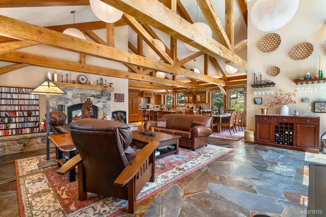 a living room with lots of furniture and a rug