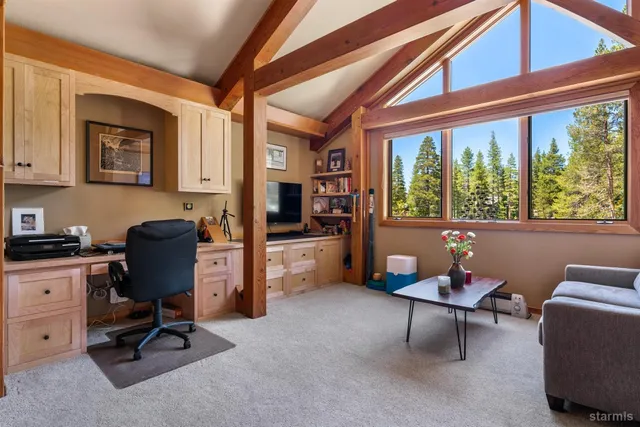 a workspace with furniture and a window