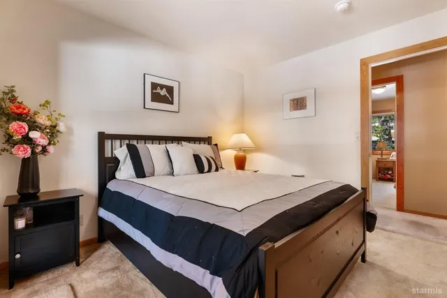 a bed room with a bed and a night stand