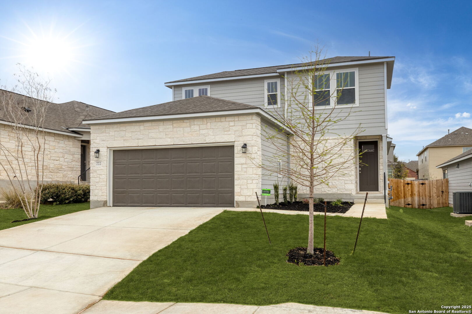 772 Ft Leonard San Antonio, TX 78245 - Photo 1 of 1 a front view of a house with a yard and garage