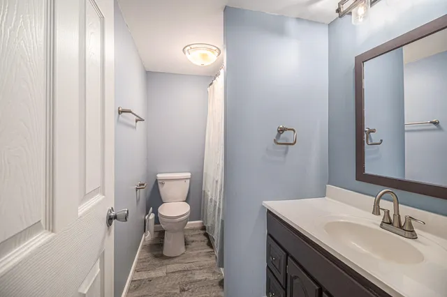 a bathroom with a sink toilet and a shower