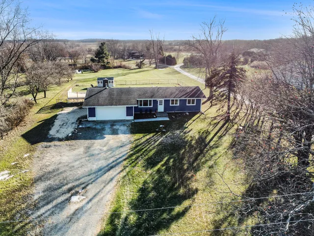 a view of a swimming pool with a yard