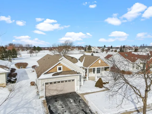 an aerial view of a house with a ocean view