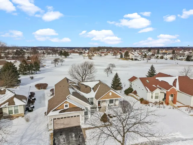 an aerial view of a building with outdoor space and ocean view