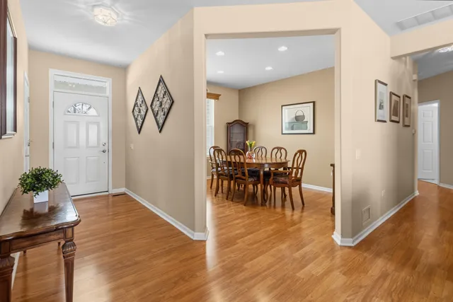 a view of dining room with furniture and wooden floor