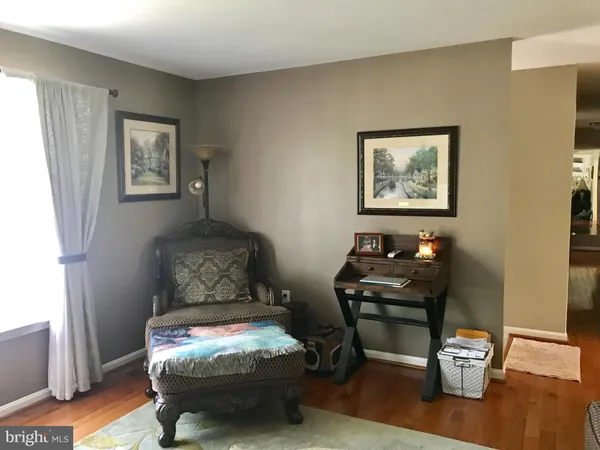 a room with furniture and wooden floor