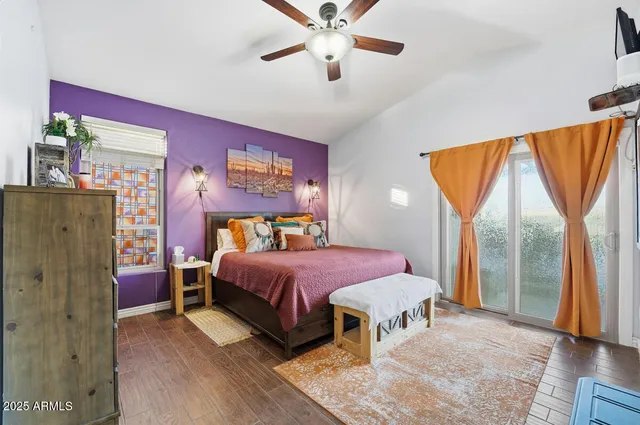 a bathroom with a double vanity sink a two mirror a glass door a shower and a bathtub