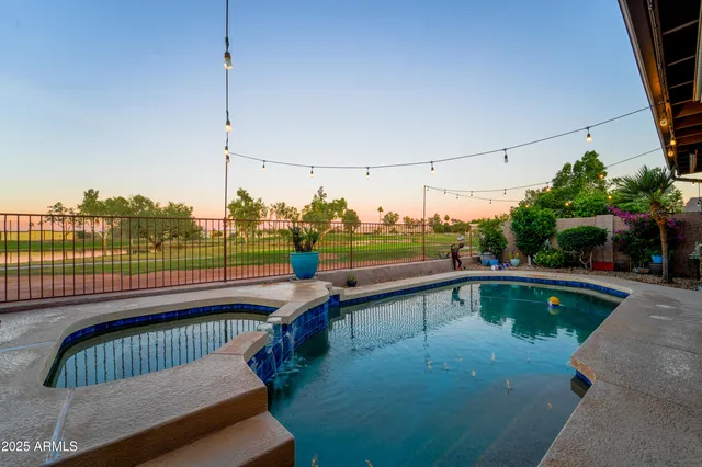 a view of a swimming pool with a lounge chairs