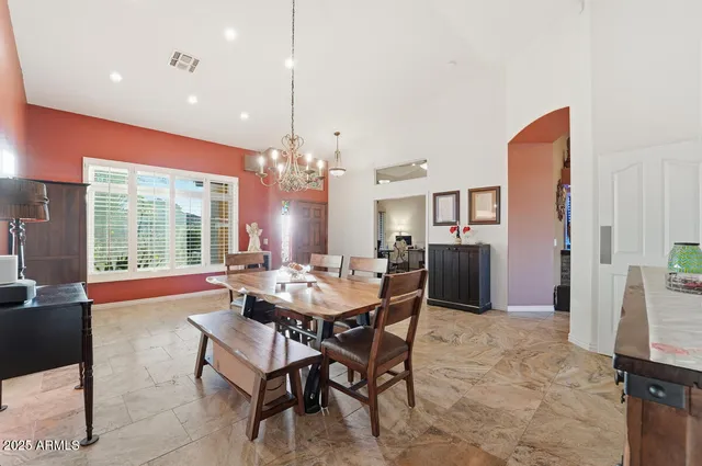 a kitchen with granite countertop a sink a counter top space and living room view