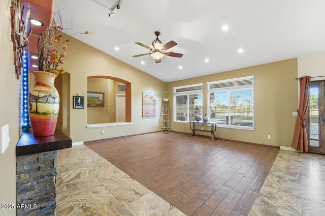 a view of a livingroom with furniture and a flat screen tv