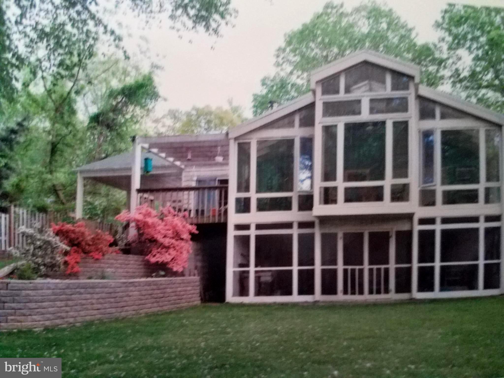 2990 Valley View Road Annapolis, MD 21401 - Photo 2 of 10 Waterside sun room captures water & woodland views