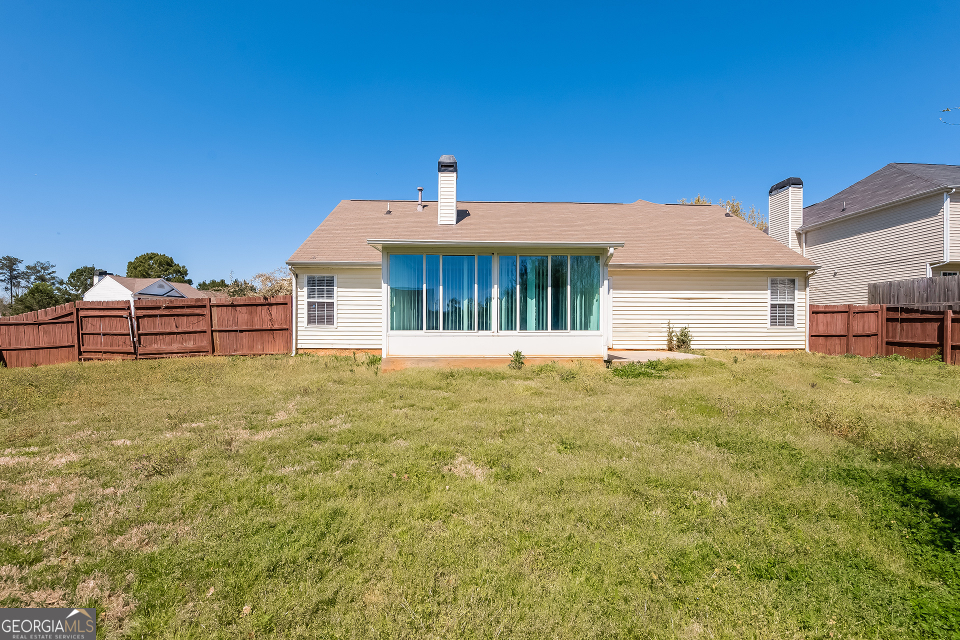 1343 Wimbleton Cove Hampton, GA 30228 - Photo 15 of 17 a front view of a house with a garden