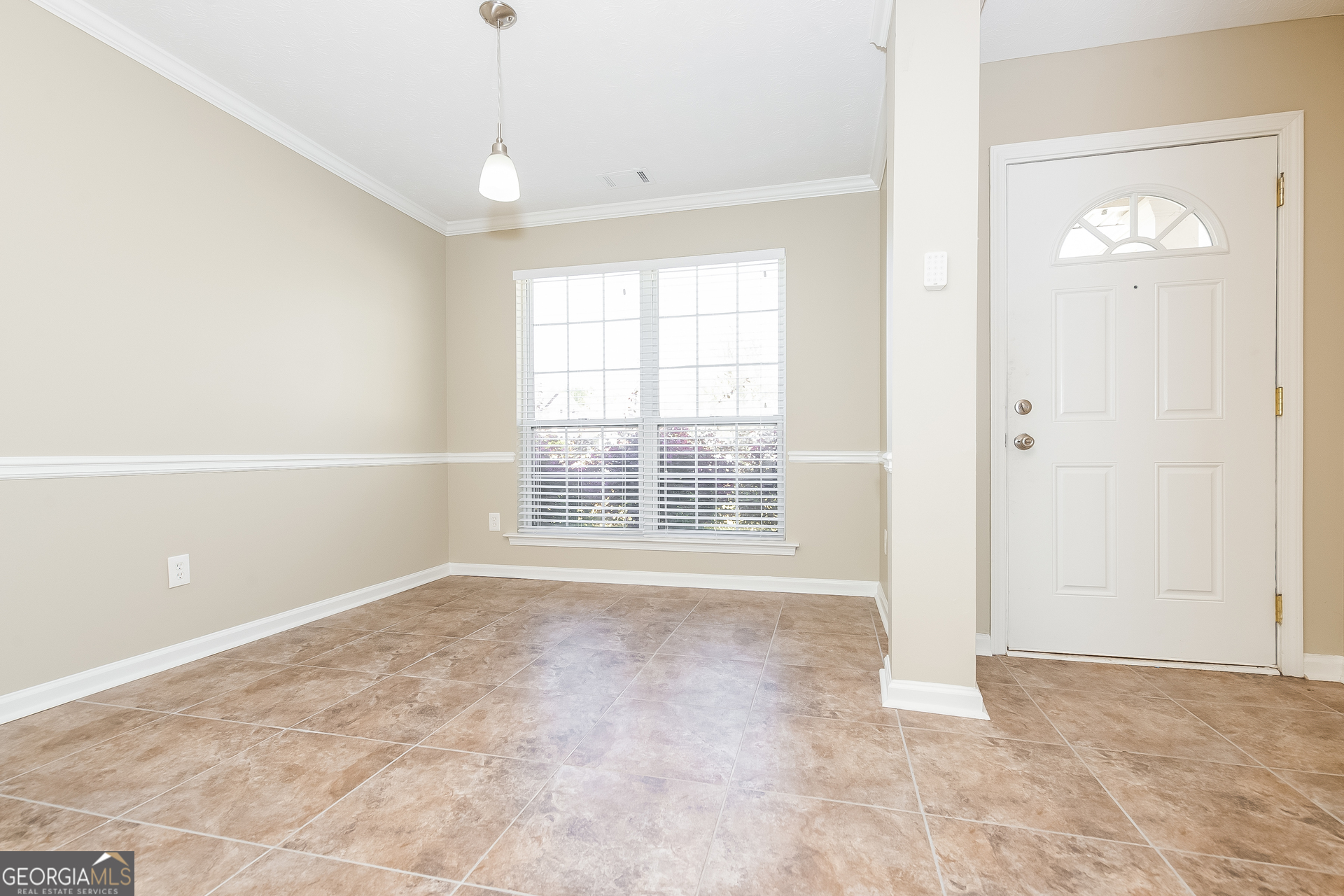 1343 Wimbleton Cove Hampton, GA 30228 - Photo 5 of 17 a view of an empty room with a window