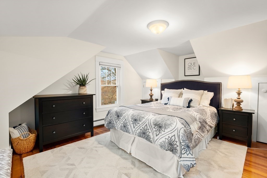 36 Shore Road Wellesley, MA 01760 - Photo 15 of 27 a bedroom with a bed and a dresser