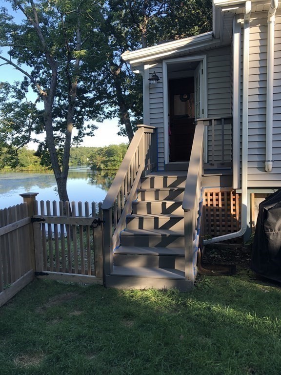36 Shore Road Wellesley, MA 01760 - Photo 23 of 27 a view of a deck with chairs and a yard