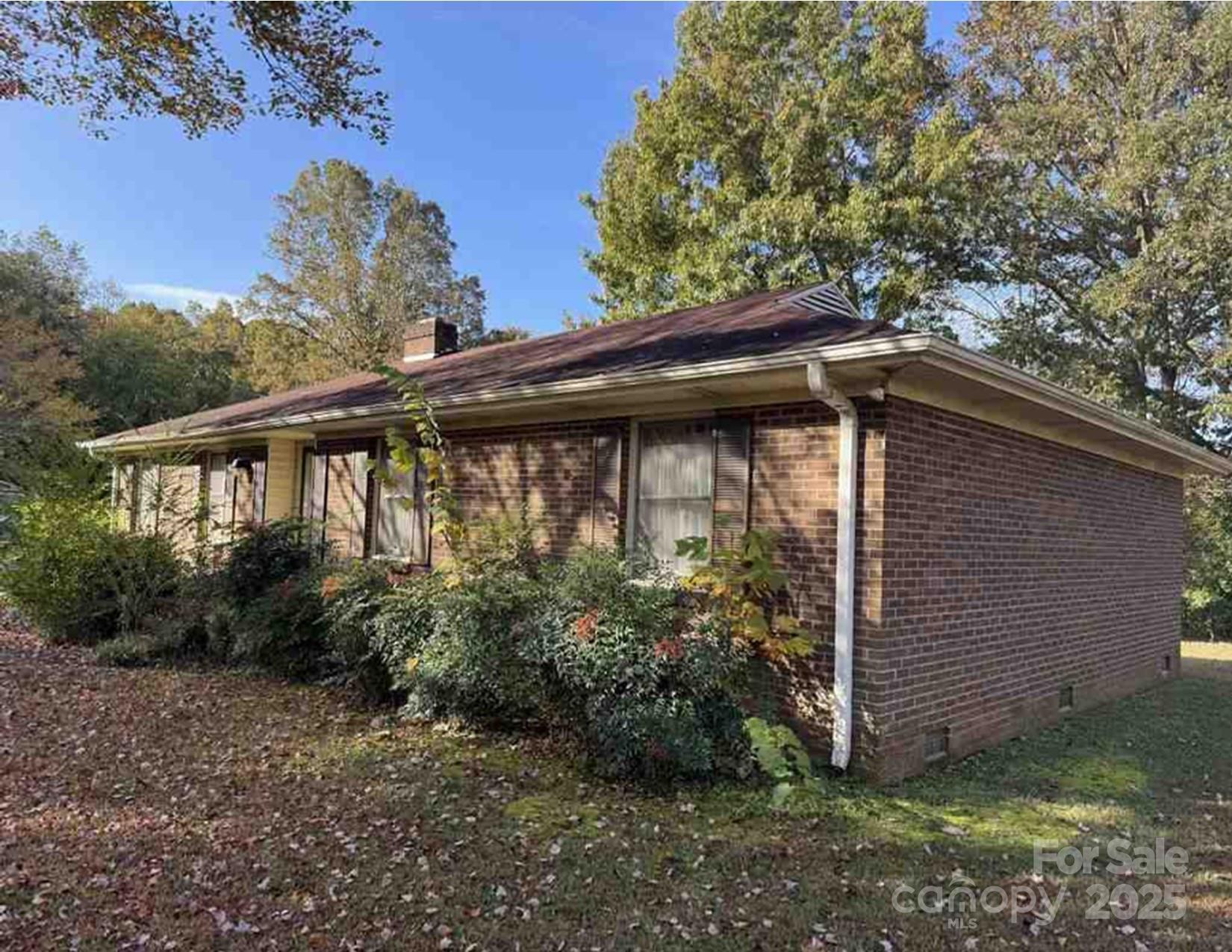 104 Spargo Street Gastonia, NC 28056 - Photo 2 of 4 a backyard of a house with lots of green space