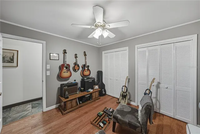 a living room with furniture a table and wooden floor
