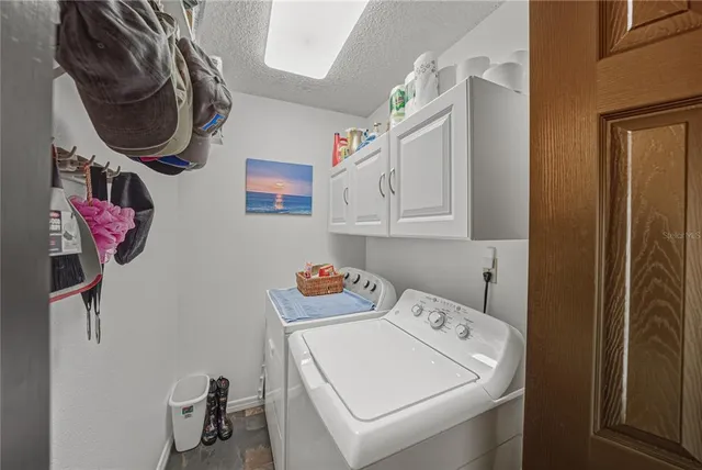 a view of a swimming pool with seating space