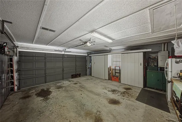 a balcony with hardwood floor and a ceiling fan