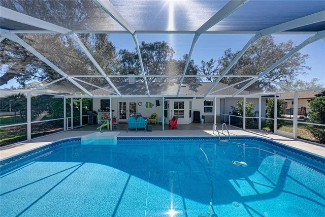 a living room filled with furniture and a wooden floor