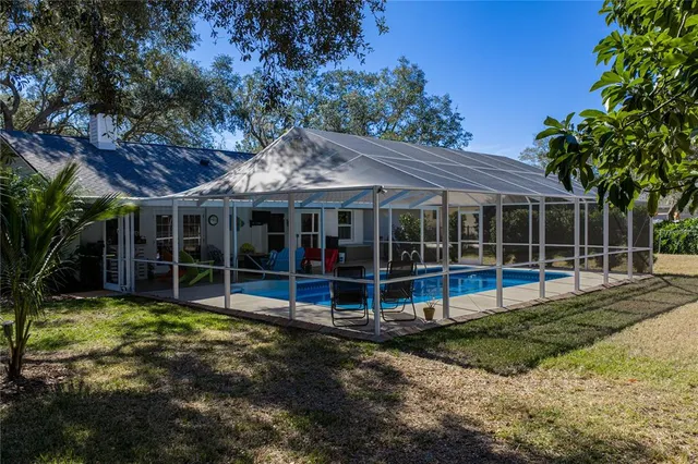 a view of a backyard with sitting area