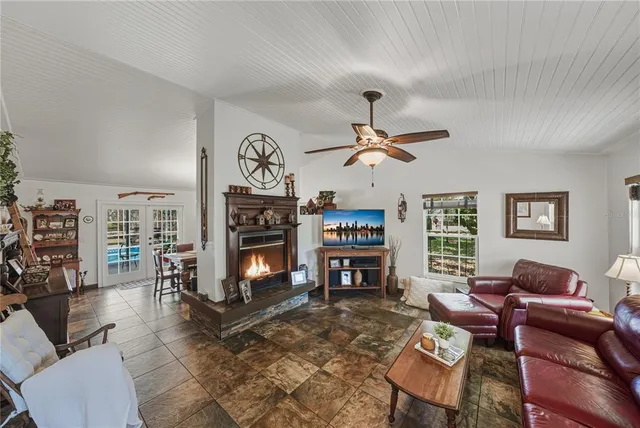 a living room with fireplace furniture and a fireplace