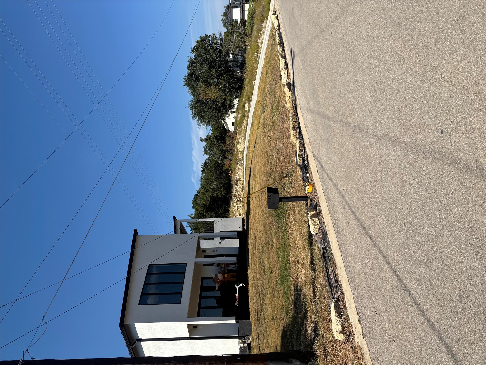 1803 Lipan Trail Austin, TX 78733 - Photo 3 of 20 a view of a house with a yard