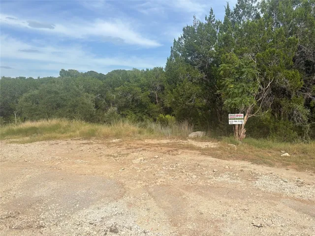 a view of a lake with a yard