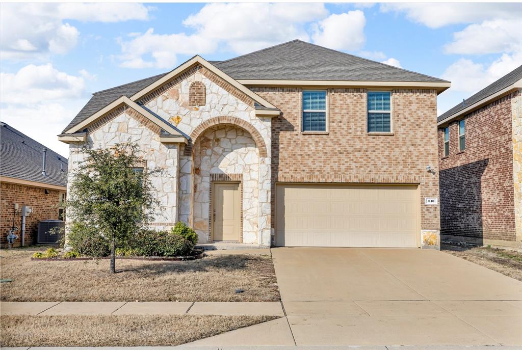 610 Bassett Hall Road Fate, TX 75189 - Photo 1 of 28 View of front of house featuring a garage and cooling unit