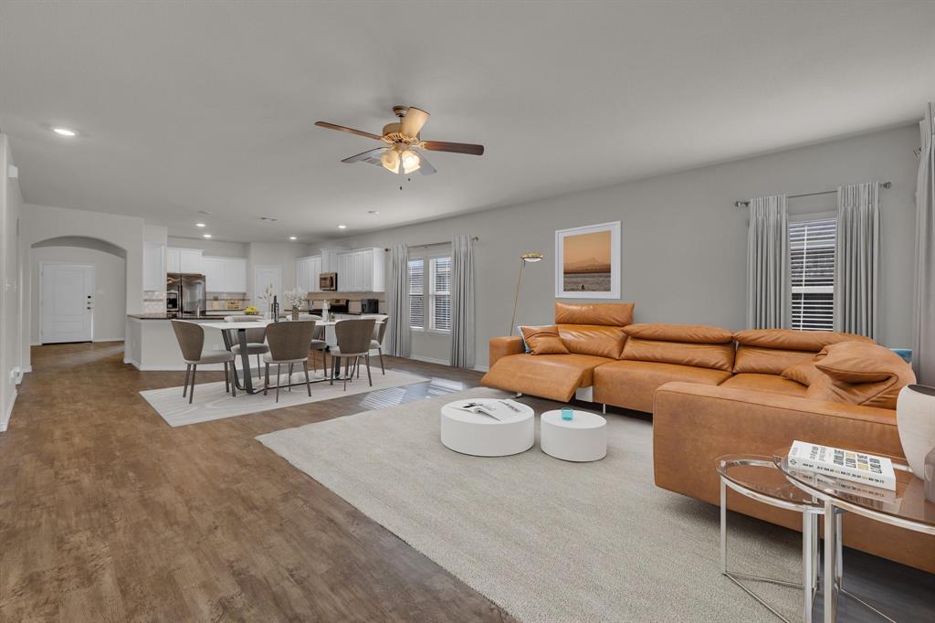 610 Bassett Hall Road Fate, TX 75189 - Photo 13 of 28 Living room featuring ceiling fan and light wood-type flooring