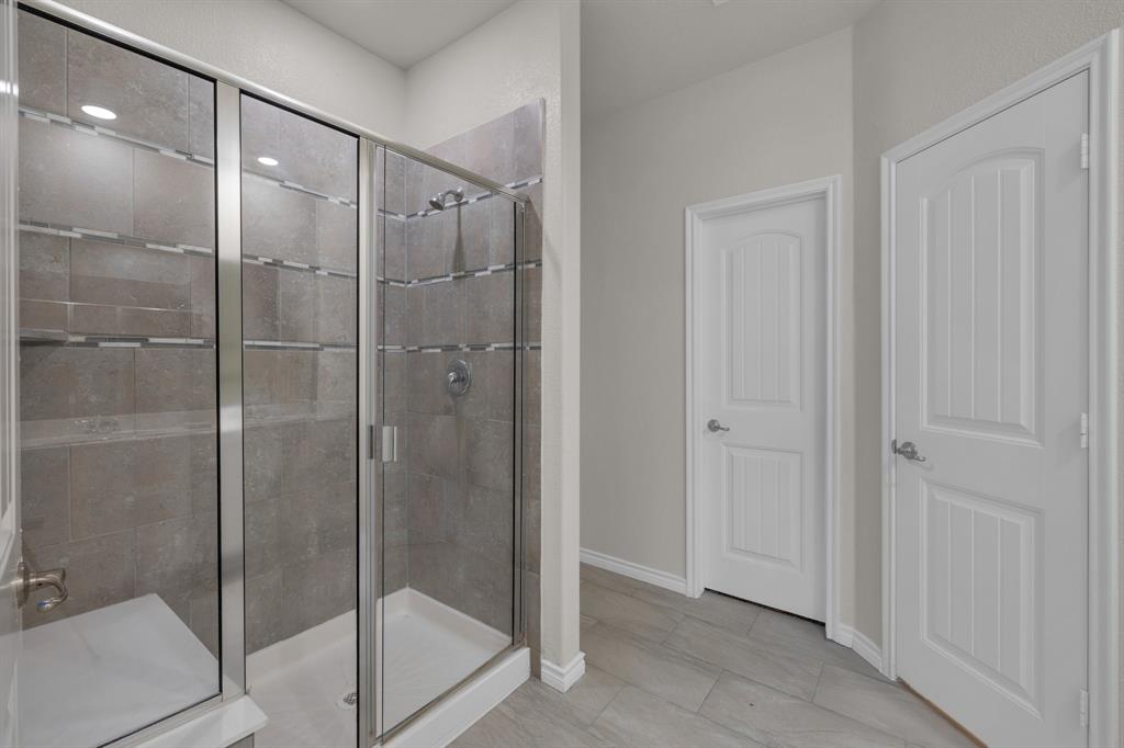 610 Bassett Hall Road Fate, TX 75189 - Photo 19 of 28 Bathroom featuring walk in shower