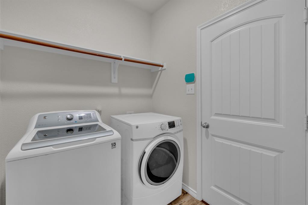 610 Bassett Hall Road Fate, TX 75189 - Photo 20 of 28 Washroom featuring washing machine and dryer
